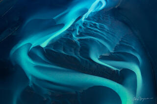 Aerial photography of Iceland waterways in the highlands as the blue ribbons of water flow to the ocean.