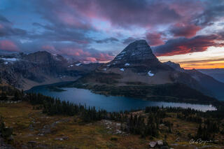 A stunning sunset over Bearhat Mountain and Hidden Lake in Glacier National Park Montana.