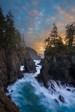 The Natural Bridges on the Oregon Coast's Samuel L. Boardman Corridor at sunset.