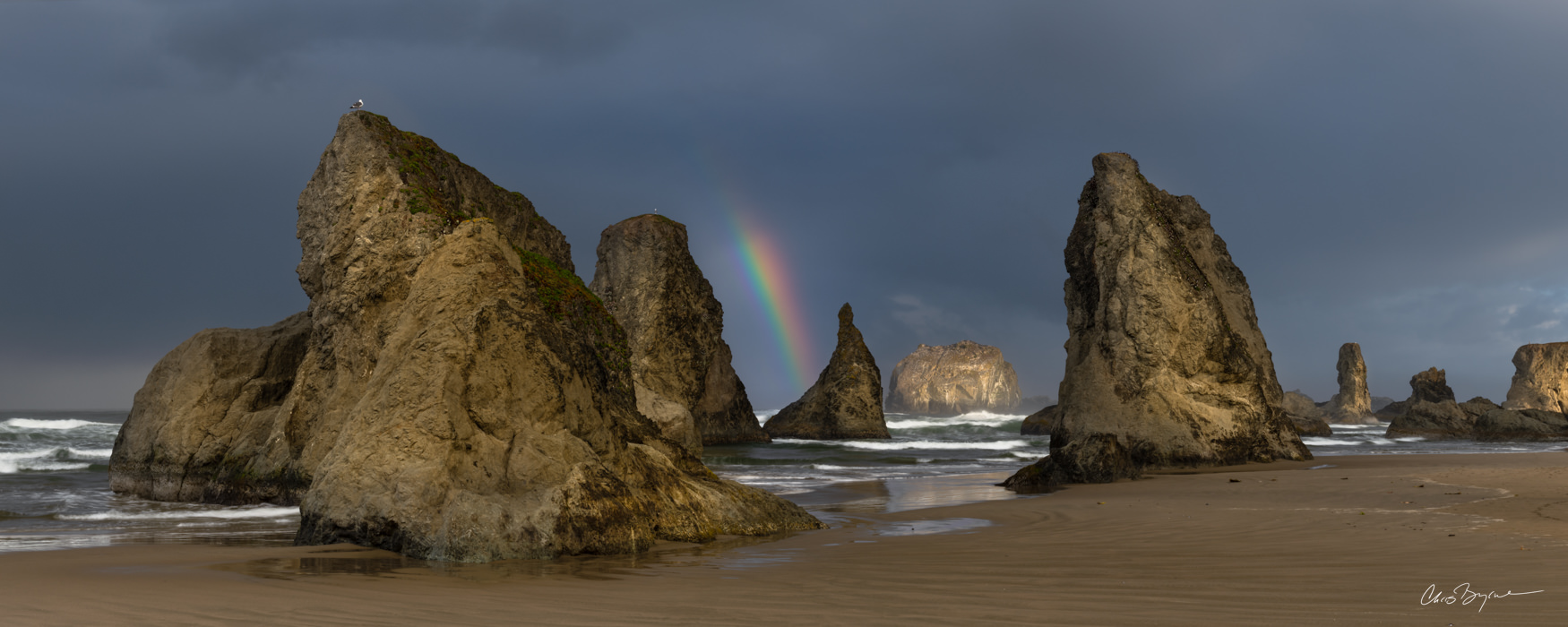 BANDON BLISS (PANORAMA) An early morning storm produced a rainbow among the sea stacks, with Face Rock catching the first rays of light for the day....