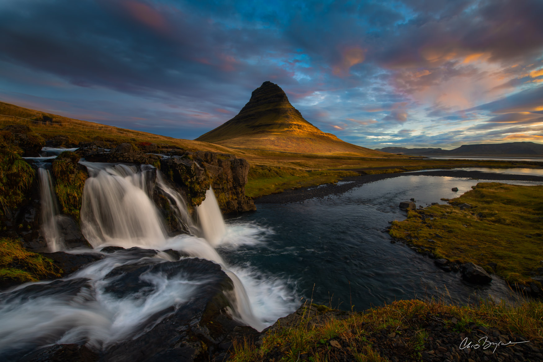 CHURCH MOUNTAIN Mountain in Iceland with a waterfall at sunset with beautiful clouds in the sky